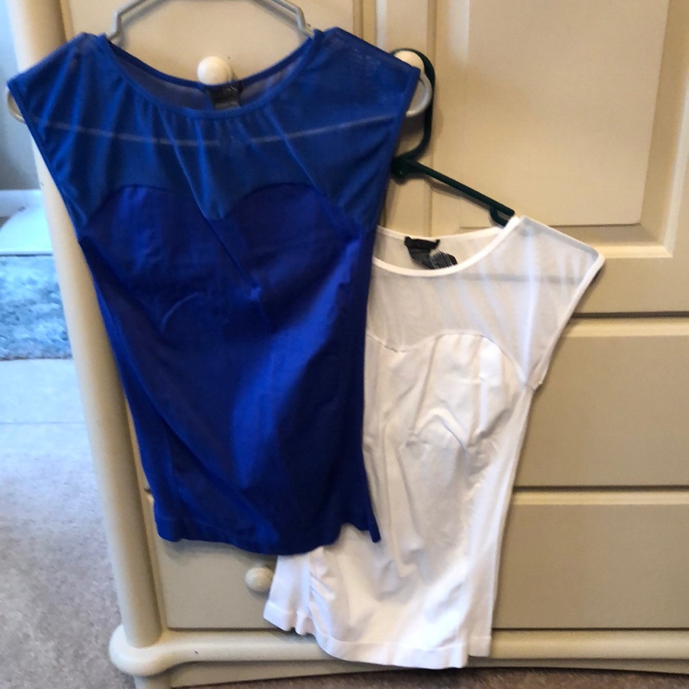 Two size small sleeveless shirts